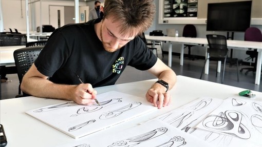 Automotive student sketching ideas