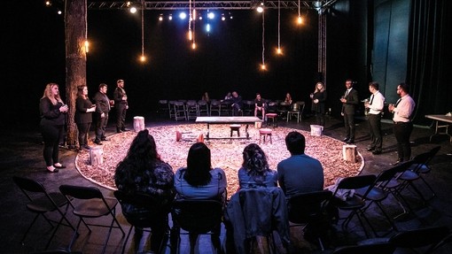 Group of people performing in a circle 