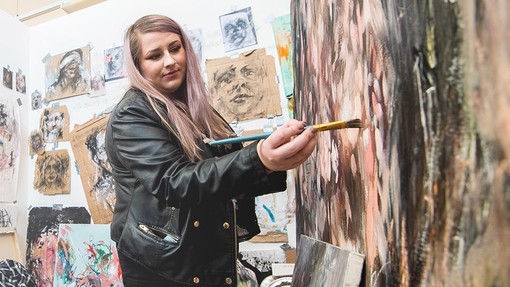 Fine Art student painting in a studio