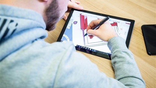 Student drawing on a tablet