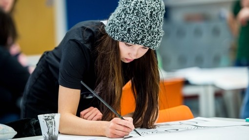 Illustration student drawing in a studio