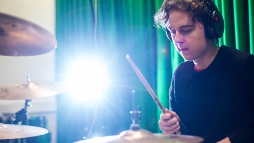 Drummer wearing headphones 