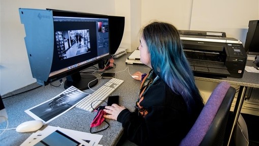 Student using photo editing software