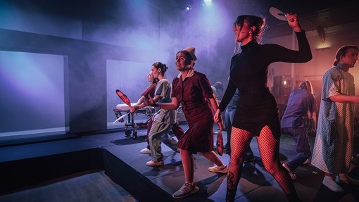 Group of students performing on stage