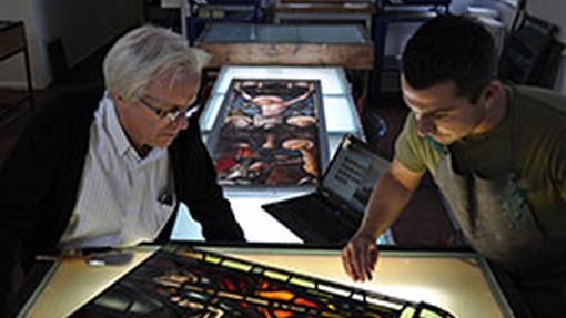 Staff and student working with glass 
